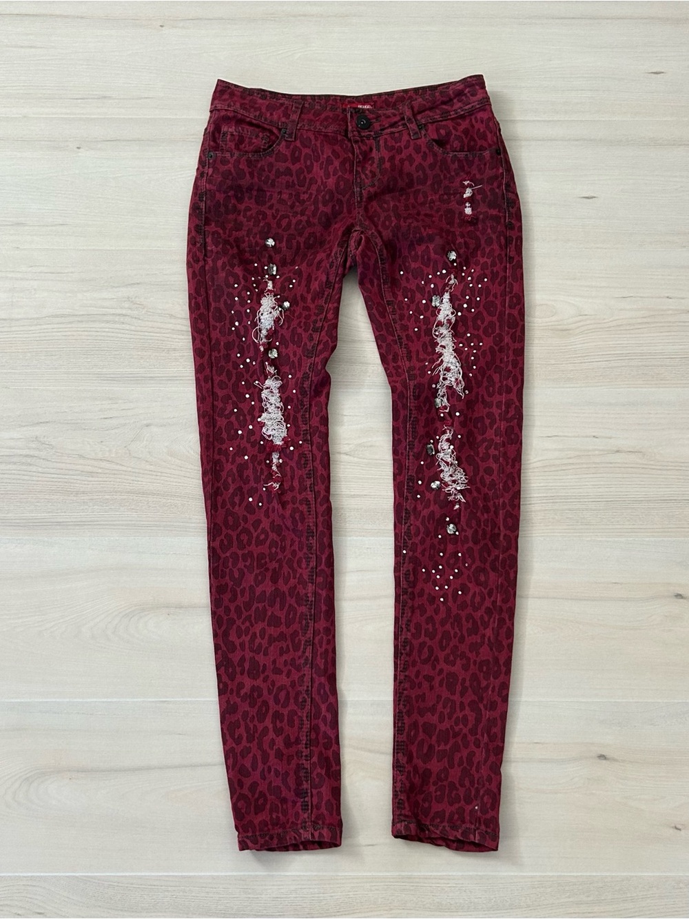 red bongo animal print studded skinny leg pants